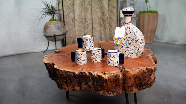 Decanter and shot-glasses on wood table Stoneware Ceramic