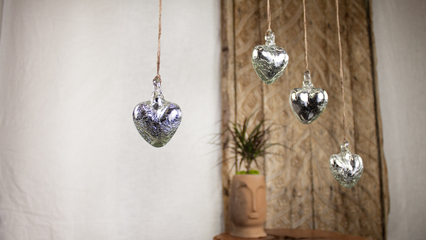 Ornamental glass hearts in mercury glass