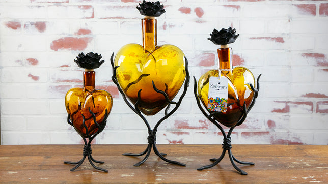 Heart Shaped Decanters in amber glass resting metal stand