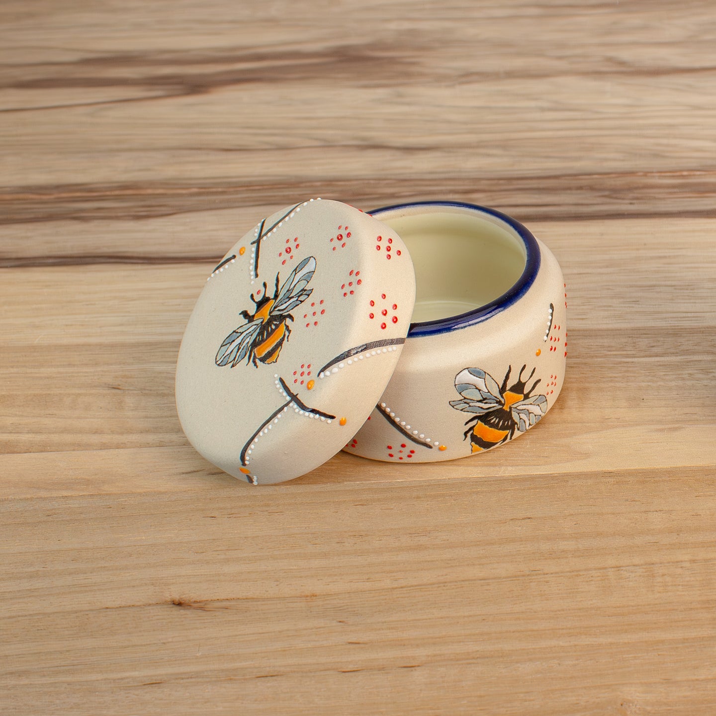 Stoneware salt cellar, small ceramic jar with lid. Bumble bee design hand painted on lid and sides.