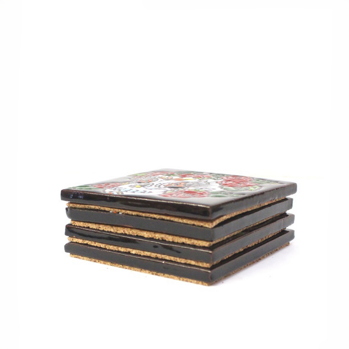 A stack of four ceramic coasters with glossy black tops featuring a colorful floral pattern, set against a plain white background.