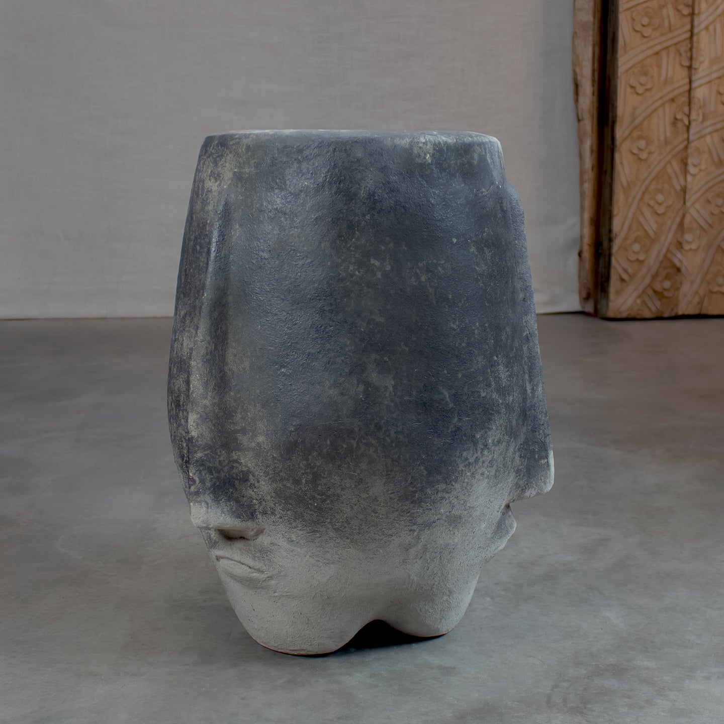 Terracotta pot with face.