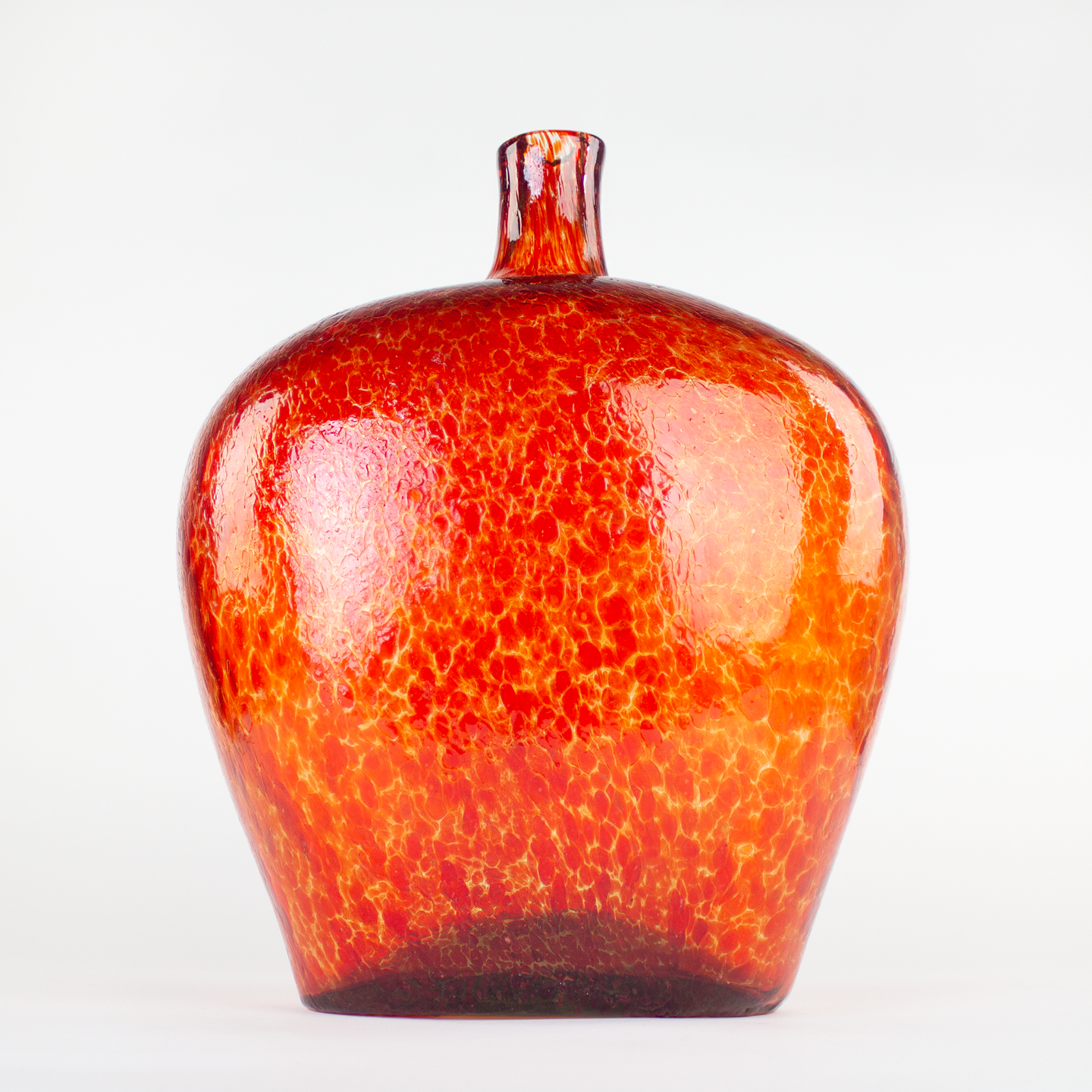 Large Red glass vase with a textured surface.