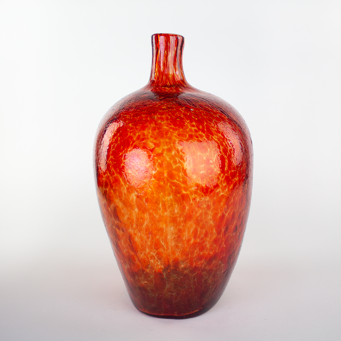 Giant hand blown glass bottle/vase turtle red textured surface.