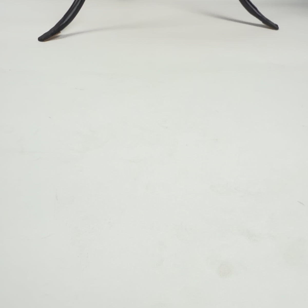 Iron pot stand and terracotta pot.