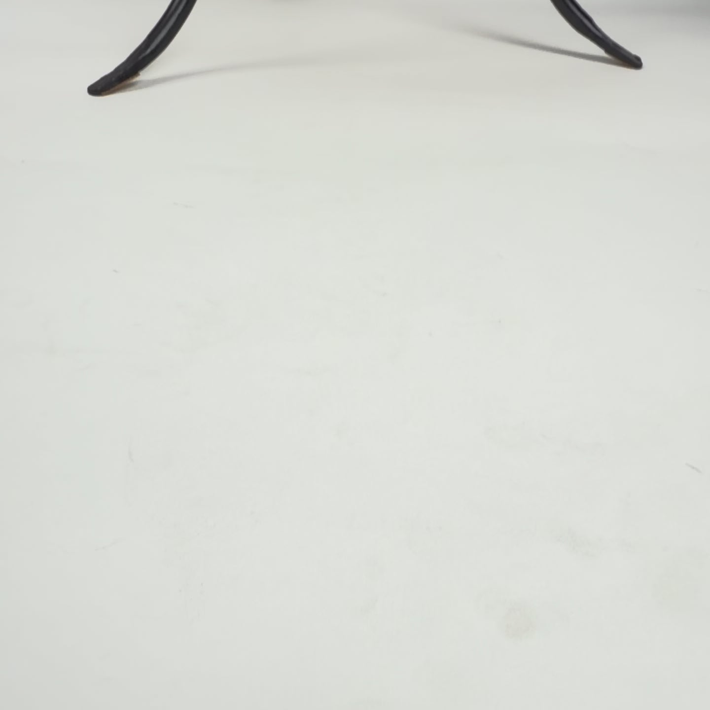 Iron pot stand and terracotta pot.